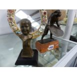 AN EARLY 20th.C.FRENCH BRONZE BUST OF A LAUGHING CHILD WITH IMPRESSED DEPOSE SEAL TOGETHER WITH A