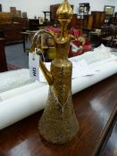 A CONTINENTAL GILT DECORATED EWER WITH STOPPER AND OVERALL FLORAL AND SCROLL DECORATION. H.40cms.