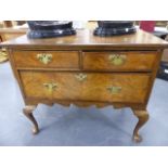 AN 18th.C.AND LATER OAK AND WALNUT LOWBOY WITH TWO SHORT AND ONE DEEP DRAWER STANDING ON CABRIOLE