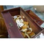 AN ANTIQUE BONE AND BAMBOO MAH-JONG SET IN A WOODEN CASE.