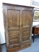 A LARGE 18th.C.AND LATER PANEL DOOR HALL CABINET. W.124 x H.192cms.