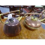 TWO ARTS AND CRAFTS COPPER AND BRASS KETTLES.