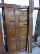 A GOOD QUALITY OAK 17th.C.STYLE FOUR POSTER BED WITH CARVED PANEL HEADBOARD.