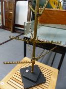 AN ART DECO BRONZE AND ALLOY SHOP DISPLAY STAND WITH ADJUSTABLE ARMS.