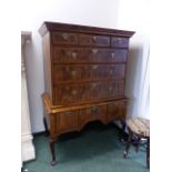 AN 18th.C.AND LATER WALNUT AND CROSS BANDED CHEST OF DRAWERS ON ON THREE DRAWER BASE STAND RAISED ON
