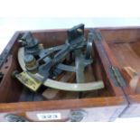 A VINTAGE ANODISED BRASS SEXTANT WITH SILVERED SCALE CONTAINED IN A MAHOGANY TRANSIT CASE.