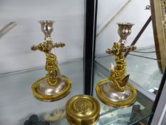 A PAIR OF VICTORIAN SILVERED AND GILT METAL CANDLESTICKS OF ANCHOR FORM H.18cms TOGETHER WITH A