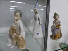 THREE LLADRO PORCELAIN FIGURES, THE ORANGE GIRL, A CHILD WITH A DOG AND A PRINCESS. H. LARGEST