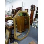 A LARGE OCTAGONAL BEVELLED PLATE MIRROR WITH REEDED AND GILT CONFORMING FRAME. 136 x 102cms.
