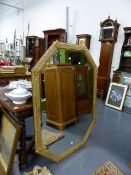 A LARGE OCTAGONAL BEVELLED PLATE MIRROR WITH REEDED AND GILT CONFORMING FRAME. 136 x 102cms.