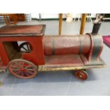 A RARE EARLY 20th.C.RIDE ON TRAIN TOY WITH ORIGINAL PAINT.