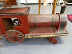 A RARE EARLY 20th.C.RIDE ON TRAIN TOY WITH ORIGINAL PAINT.