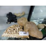 AN ARTIC REGION INUIT ESKIMO CARVED STONE FIGURE OF A BEAVER, A CHALK STONE PIERCED COMB, A WALRUS