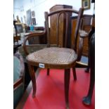 A THONET BENTWOOD CHILD'S ARMCHAIR.