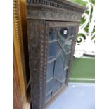 A 19th.C.SMALL CARVED OAK CORNER CABINET AND AN OAK PIGEONHOLE CABINET.