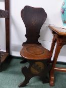 A PAIR OF 19th.C.OAK HALL CHAIRS WITH PAINTED GRIFFIN AND ARMORIAL DECORATION.