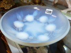 A FRENCH MOULDED GLASS BOWL BY ETLING WITH FLOWERHEAD DECORATION. D.22cms TOGETHER WITH AN ART