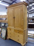 A 19th.C.PINE LINEN PRESS WITH PANEL DOORS ENCLOSING SHELVES OVER TWO SHORT AND TWO LONG DRAWERS,