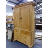 A 19th.C.PINE LINEN PRESS WITH PANEL DOORS ENCLOSING SHELVES OVER TWO SHORT AND TWO LONG DRAWERS,