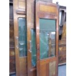 A GROUP OF FOUR ANTIQUE RAILWAY SLIDING DOORS WITH GLAZED PANELS.