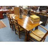 A GOOD QUALITY 18th..C.STYLE OAK REFECTORY TABLE TOGETHER WITH A SET OF SIX RUSH SEAT LADDER BACK