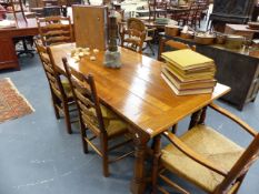 A GOOD QUALITY 18th..C.STYLE OAK REFECTORY TABLE TOGETHER WITH A SET OF SIX RUSH SEAT LADDER BACK