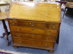 A LATE 18th.C.OAK BUREAU WITH THREE SHORT AND THREE LONG DRAWERS ON BRACKET FEET. W.92 x H.101cms.