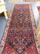 A PERSIAN HAMADAN RUNNER. 390 x 140cms.