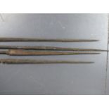 A GROUP OF FOUR ANTIQUE TRIBAL FISHING SPEARS WITH CARVED DECORATION, PROBABLY OCEANIC