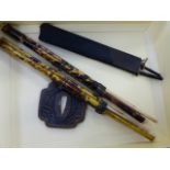 TWO JAPANESE TORTOISHELL AND BRASS MOUNTED TROUSSE EATING SETS, TOGETHER WITH A PAIR OF MINIATURE