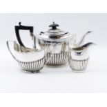 A THREE PART SILVER HALLMARKED TEA SET DATED 1897 BIRMINGHAM. APPROXIMATE WEIGHT ALL IN 486grms.