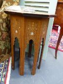 AN ANTIQUE SYRIAN INLAID HARDWOOD OCTAGONAL STAND WITH MOTHER OF PEARL INSETS. H.57, D.45cms. AND