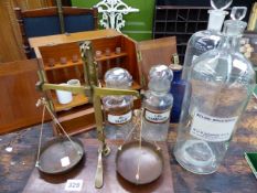 A VINTAGE MAHOGANY APOTHECARY'S CABINET WITH FIVE VARIOUS DRUG JARS, TWO WITH GLASS LABELS AND AN