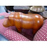 AN UPHOLSTERED LEATHER HIPPO FORM FOOTSTOOL IN THE MANNER OF LIBERTYS.