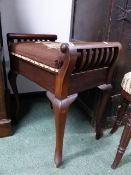 AN EDWARDIAN MAHOGANY BOX SEAT PIANO STOOL.