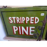 A HAND PAINTED SIGN WITH WROUGHT IRON BRACKET, STRIPPED PINE.