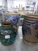 AN EASTERN BALUSTER JAR WITH FOLIATE DECORATION TOGETHER WITH TWO STONEWARE TWIN HANDLE CROCKS