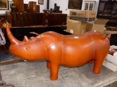 A LARGE LEATHER RHINO FORM FOOTSTOOL IN THE MANNER OF LIBERTY'S.