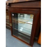AN ANTIQUE MAHOGANY GLAZED CABINET WITH MIRRORED BACK.