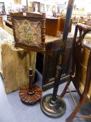 A 19th.C.ROSEWOOD POLE SCREEN TOGETHER WITH A CHINOISERIE DECORATED STANDARD LAMP.