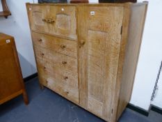 A RARE AMBROSE HEAL DESIGN LIMED OAK SIDE CABINET WITH ARRANGEMENT OF TWO SMALL DOORS OVER FOUR