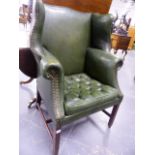 AN ANTIQUE GEO.I.STYLE LEATHER UPHOLSTERED WING BACK ARMCHAIR. W.82cms. OVERALL