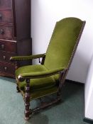 AN INTERESTING 17th.C.STYLE OAK FRAMED ARMCHAIR WITH IRON MOUNTED RECLINING HINGED BACK.
