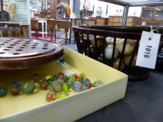 A MAHOGANY OVAL BASKET WITH HANDLE CONTAINING A COLLECTION OF POLISHED HARDSTONE BALLS TOGETHER WITH