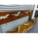 A LARGE MID CENTURY ROSEWOOD AND CUT STEEL DISPLAY GALLOPING HORSES.
