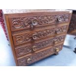 A COLONIAL CARVED TEAK FOUR DRAWER CUTLERY CABINET. W.60cms.