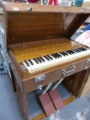 A GOOD QUALITY OAK CASED PORTABLE HARMONIUM PEARL RIVER , COLLAPSES INTO SELF CONTAINED CARRY CASE.