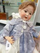 A LARGE GERMAN BISQUE HEAD DOLL STAMPED 914 GERMANY.