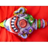 AN UNUSUAL ABSTRACT CLOWN HEAD ADVERTISING FIGURE.