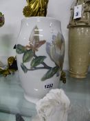 A DANISH B & G MAGNOLIA DECORATED BALUSTER VASE, H.24cms AND A BISQUE MODEL OF A ROSE. (2)